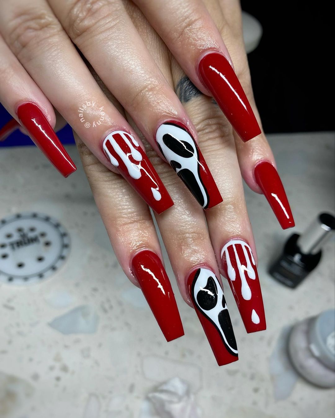 Uncover the haunting allure of our nail art collection, featuring a mesmerizing blend of blood-red hues and ghostly designs.