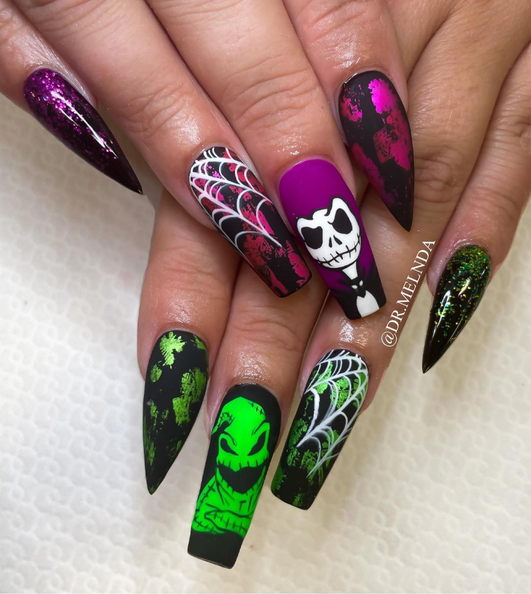 Exquisite and captivating nail art designs featuring the enchanting combination of purple witches and green devils.